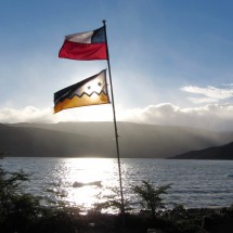 Chilean and Patagonian flags with Lago Grey